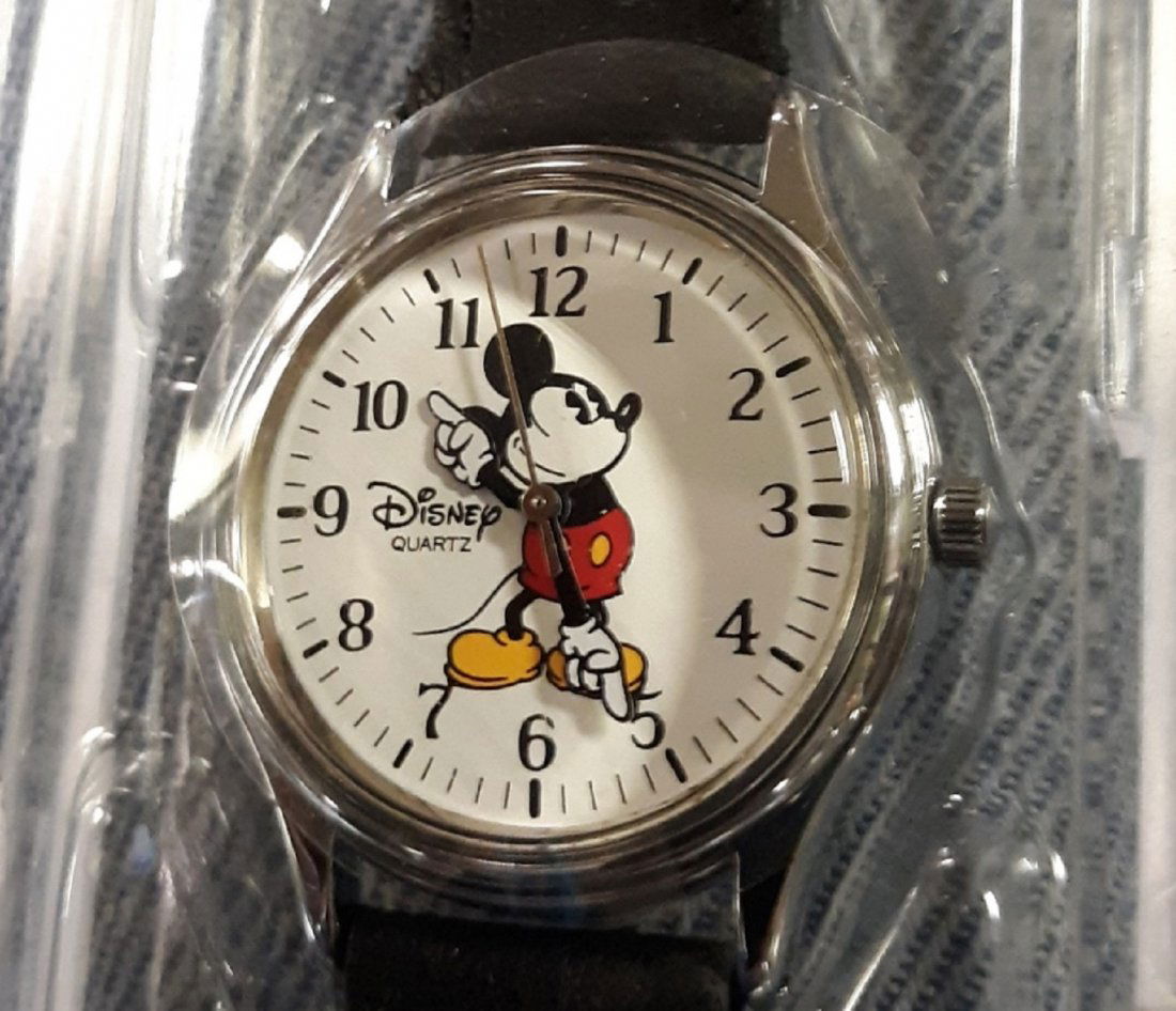 Disney Mickey mouse watch mint in box!: Disney Mickey mouse watch mint in box! never worn orig tags orig plastic protector on dial leather band and orig box 9" long should fit most! beautiful! see pics