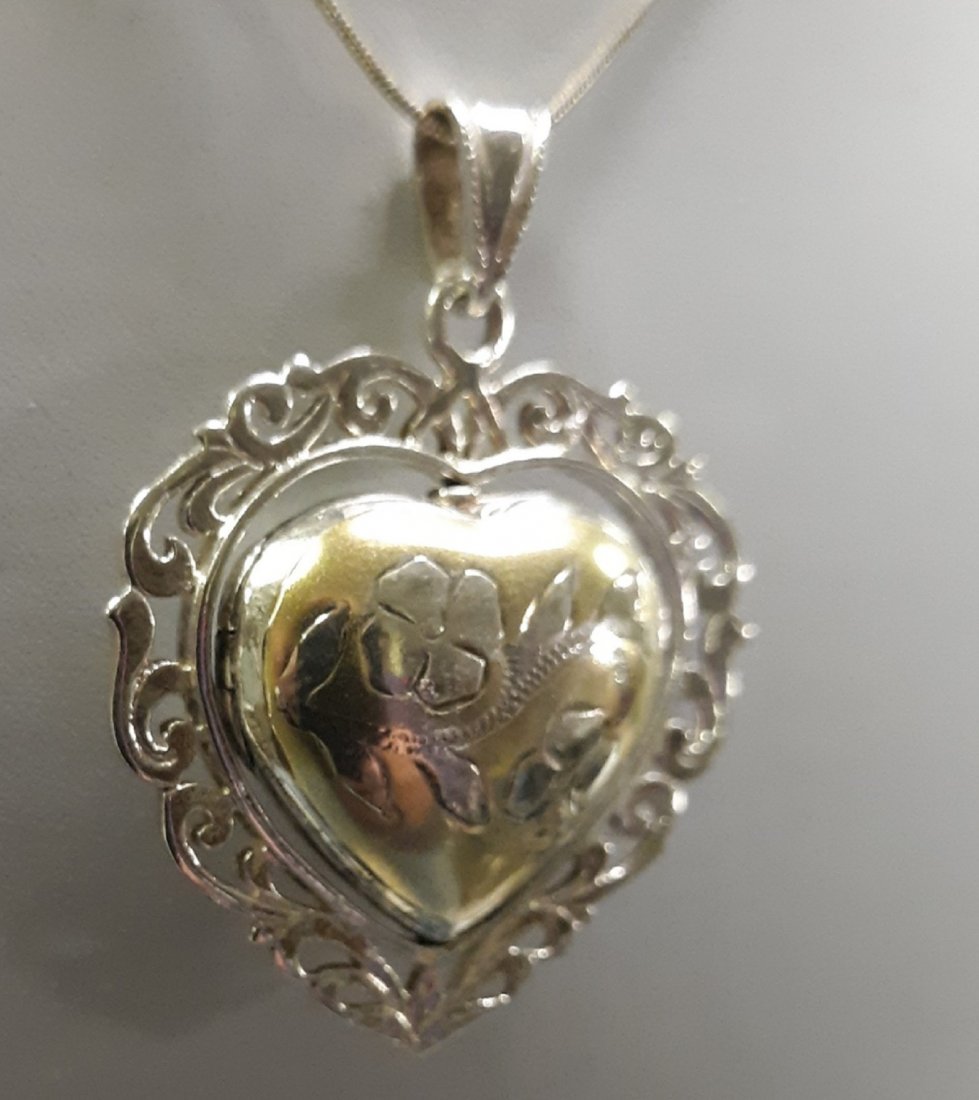 Taxco CJ 925 Heart locket w/gold wash stunning!: beautiful mid century Taxco signed CJ & 925 heart locket gold wash on one side, heart locket rotates opens for keepsake photos on 17" sterling chain gorgeous condition locket measures 2" x 1 3/4" see