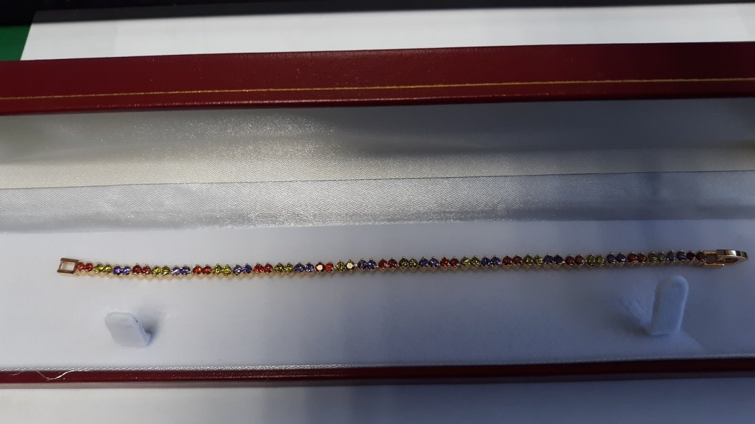 Peridot,Amethyst,and garnet tennis bracelet 7": Peridot,Amethyst,and garnet tennis bracelet 7" lab created stones? i do not see any markings on the bracelet see pics