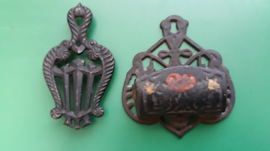 estate lot of 2 Cast iron trivet & match holder striker: estate lot of 2 Cast iron trivet & match holder strikersmall cast iron trivet signed on back lyre H Burns approx 4" long and cast iron match holder striker approx 4 1/4" long both look in very good co