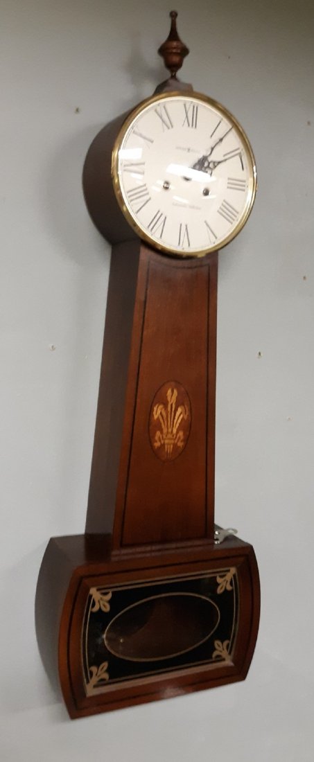 Howard Miller Ambassador 620-216 Collection Banjo Clock: gorgeous estate clock working great! Howard Miller upper line ambassador series Cherry Case strikes hour and half working great #620-216 34 1/2" tall 5 " deep w/key see picssome light dial scratches b