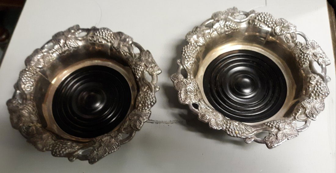 Antique Wine Bottle silver-plate Coasters/bakelite pair: Antique Wine Bottle silver-plate Coasters/ bakelite pair beautiful pair of grape motif silver plated wine champagne coasters with bakelite bottoms 7" x 1 5/8" tall in very good condition see pics