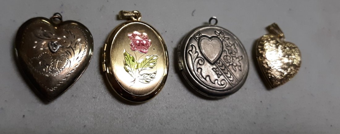 vintage locket's lot of 4 gold filled 1 has diamond!: 4 beautiful vintage estate lockets 2 are gold filled 1 looks to be sterling and the smaller heart one is unmarked, the larger gold heart also has small diamond chip all are in very good condition see 