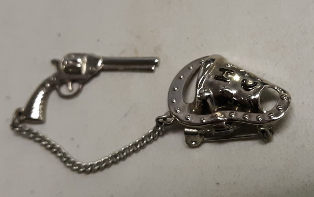 vintage 50's? brooch pin revolver & holster signed HC: beautiful estate brooch pin of a revolver with holster has hc on the holster no other markings holster is 1" gun is 1 1/2" beautiful piece of jewelry. see pics