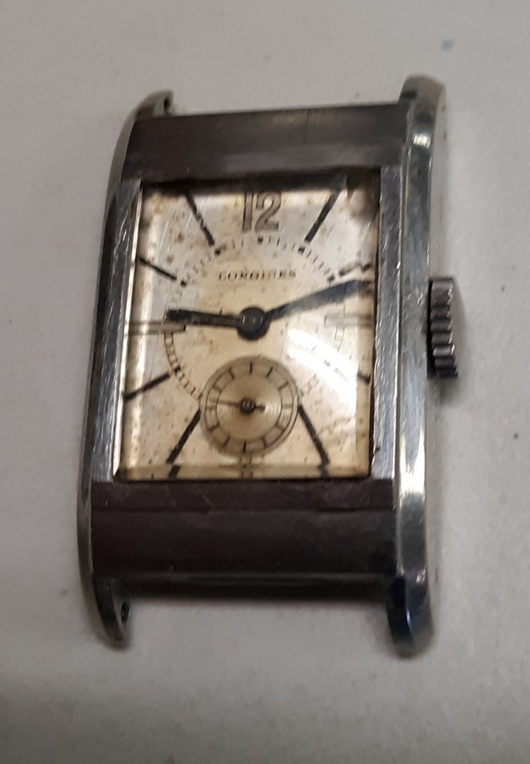 Longines Watch 1934 14K? needs repair 20.28 caliber mov: rare estate watch by longines serial #5259285 1934 wont wind just turns hands fine, 20.28 caliber movement check out the pics case in good cond crystal has a teeny chip see pics