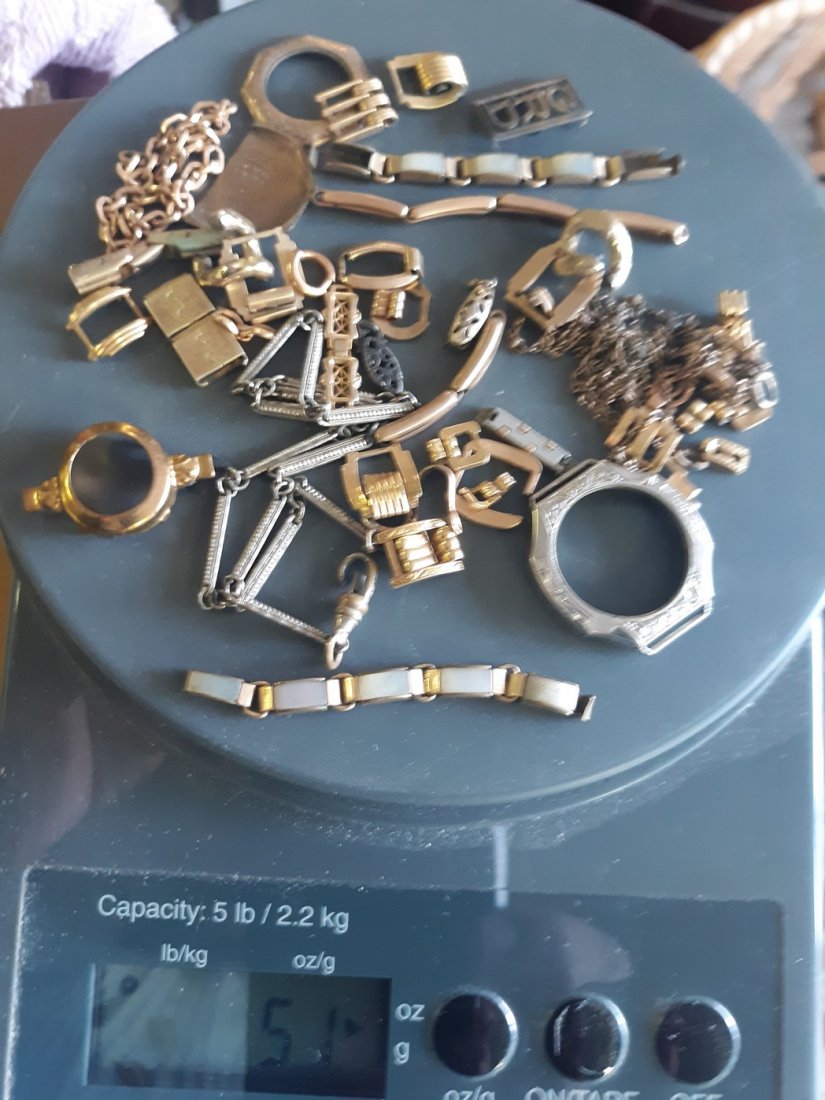 Scrap Gold Mixed lot of links,cases,chains 51 grams: lots of unmarked pieces probably G.F. 14K marked piece, chains watch band pieces check out the pics