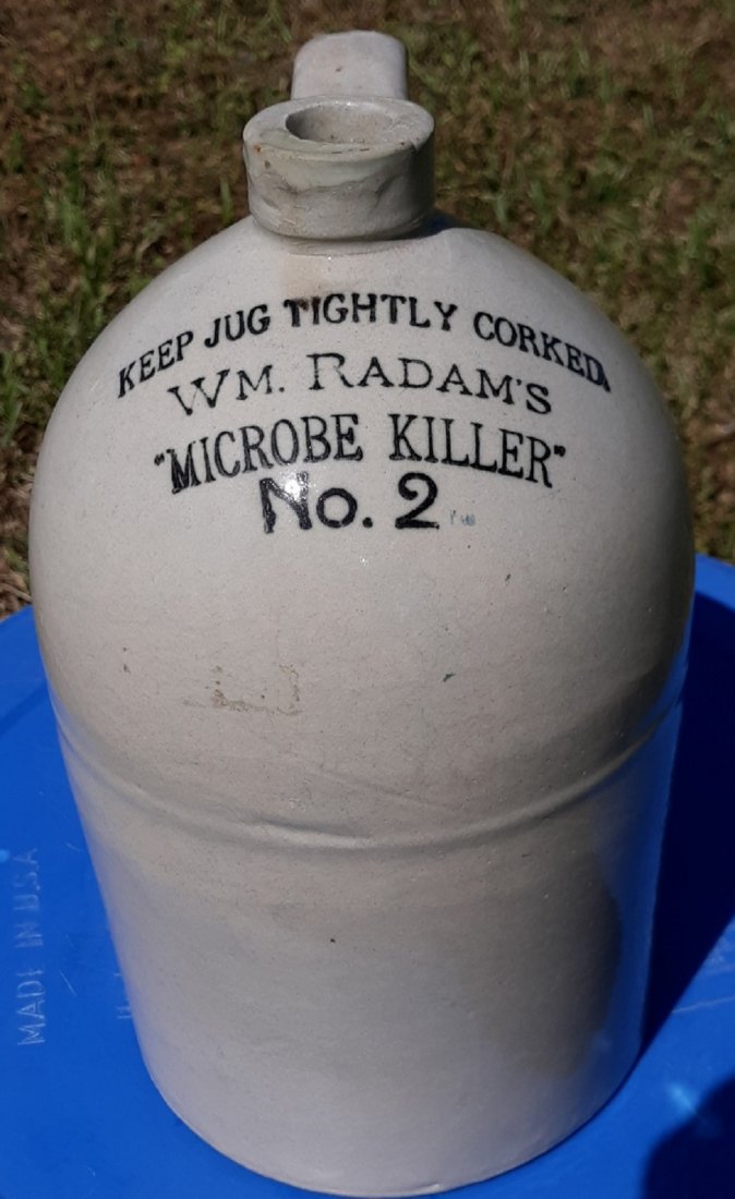 WM Radam's Microbe Killer #2 Jug Crock: from estate collection 1 gallon? 10 1/2" tall 6 1/4" across bottom expected crazing and looks like an older spout repair, see pics