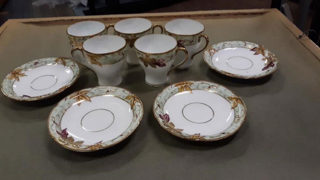 Hand Painted Japan china lot of 9: hand painted japan 5 tea cups all look good one i do see a tiny hairline at top 3" tall nicely decorated not signed on bottom 4 saucers all marked hand painted japan on back 5 1/8" wide they all look