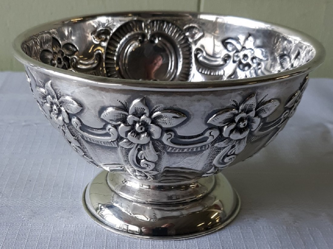 antique Sterling? Bowl hallmarked: hallmark of crown left facing lion & G also has a makers mark? 4 5/8" across top 2 3/4" tall some dark spots in center haven't tried to clean it. gorgeous high quality piece. see pic