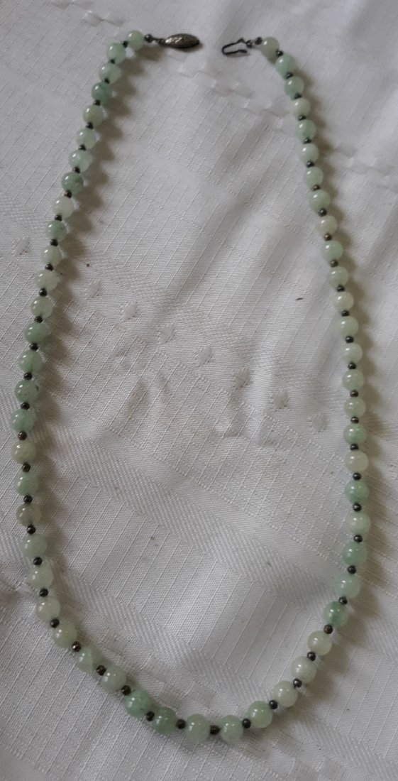 jade vintage necklace w/sterling? 25": gorgeous estate necklace natural jade appears to be sterling clasp and separating beads, but do not find marking see pics