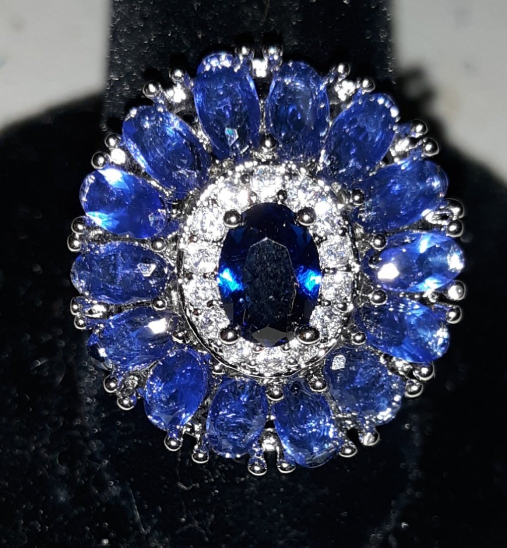 Ring tanzanite? color stone w/sapphire? LOOK!: beautiful estate ring I do not find any marking whether sterling or gold? looks like tanzanite? color stone sz 6 gorgeous ring