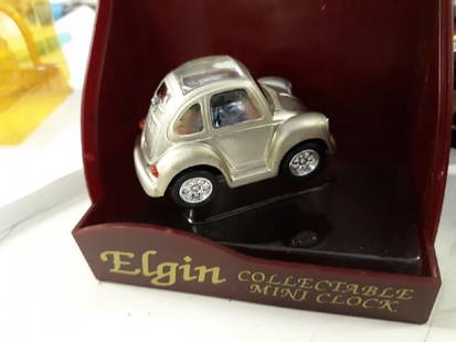 Elgin Clock Collectible Mini VW In Orig Box: Elgin Collectible mini VW clock in Orig Box nice vintage elgin VW bug clock in original pkg needs battery car clock in very good condition package is aged. see pics