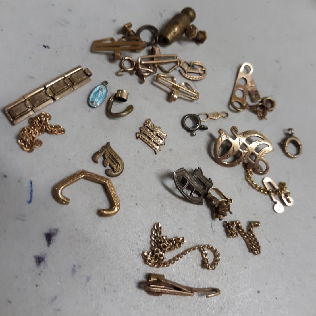 scrap gold lot 10 k too!: from estate was marked as gold scrap i do see several pieces including clasps marked 10K and alot of unmarked maybe gold filled or even 14K? 9 grams total