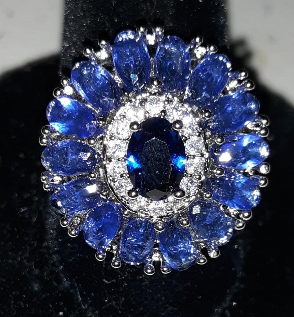 Ring Tanzanite? Color Stone W/Sapphire?: beautiful estate ring I do not find any marking whether sterling or gold? looks like tanzanite? color stone sz 6 gorgeous ring