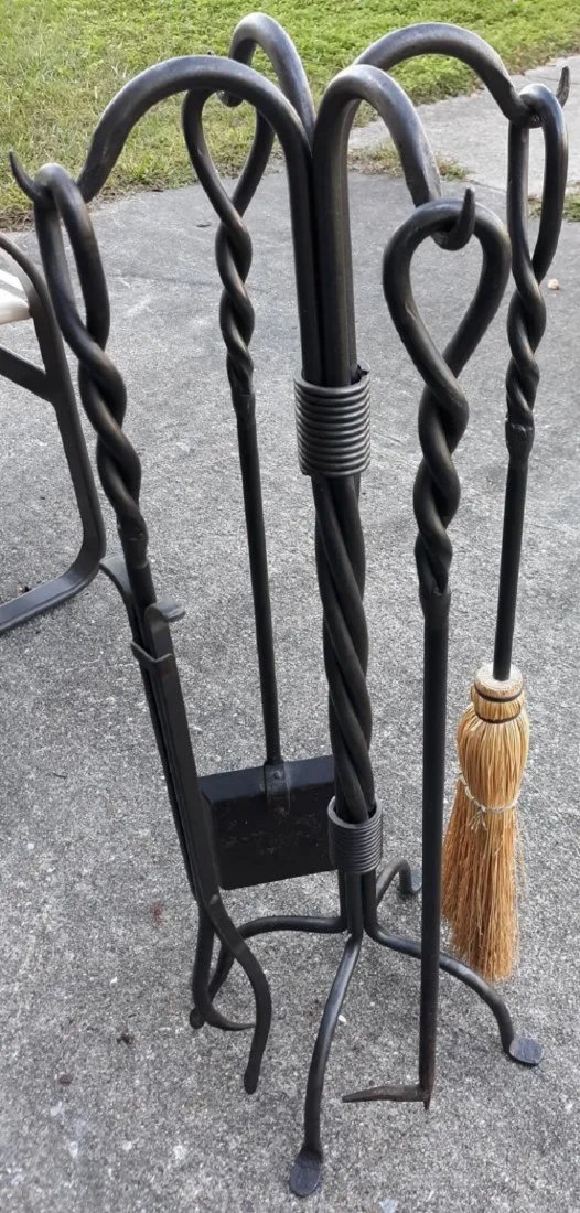 heavy stand wrought iron with 4 pieces and stand Helix: heavy stand wrought iron with 4 pieces and stand total of 5 pieces, broom, log holder, poker, shovel, stand 31" tall in exc used conditon see pics