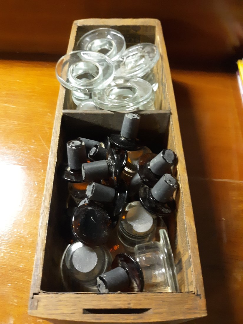 antique bottle stoppers clear & brown apothecary +: from estate large collection of clear and brown apothecary style stoppers and the antique wood drawer all for one bid most are undamaged too! see pics looks like appx 30!