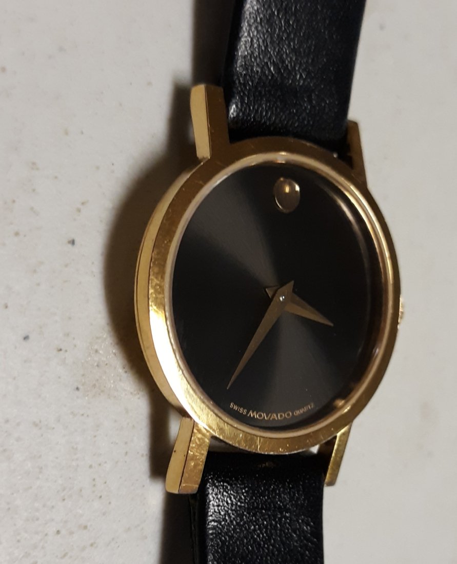 swiss movado museum black gold tone leather watch: authentic movado museum black gold tone w/ leather strap Womens model 87.a1.8321 stainless steal gold plated serial #3269999 see pics