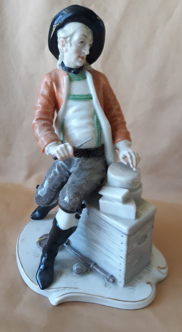 nymphenburg porcelain market cheese vendor figure: nymphenburg porcelain early 20th c of a street vendor selling cheese a superb piece with losses upper boot ribbon under the leg not noticeable except on close inspection a we found. displays gorgeous 