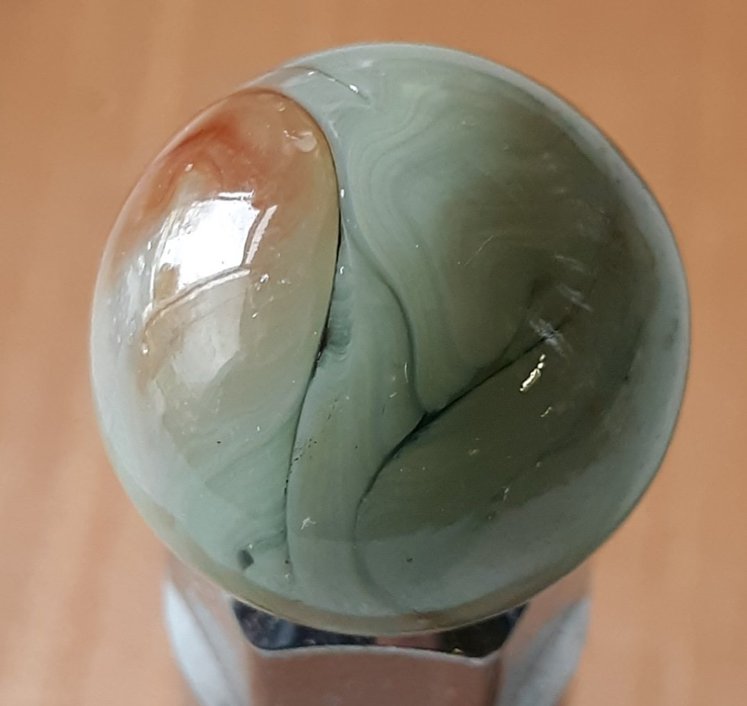 vintage marble toy shooter serpentine swirl 1": beautiful swirl orange rust color green stripe light play marks 1" appx see pics