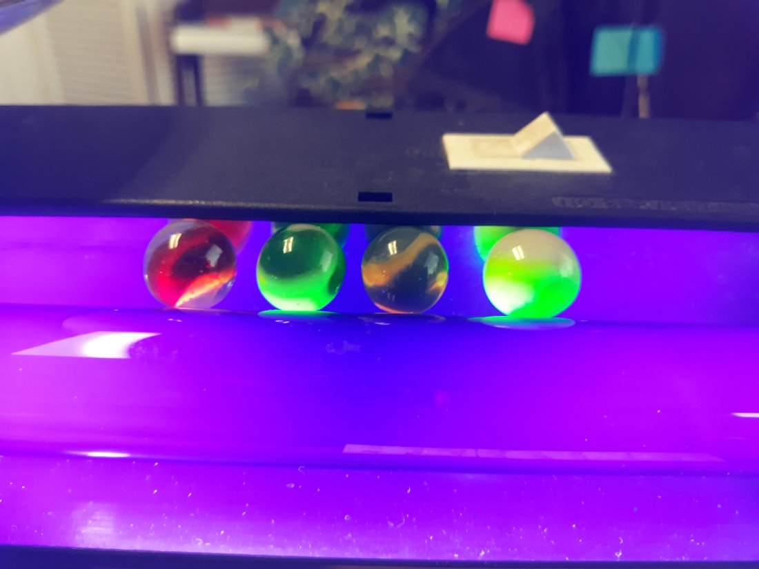 lot of 4 toy marbles glowies red swirls 5/8": from estate collection all glow under black light appx 5/8" + or - see pics