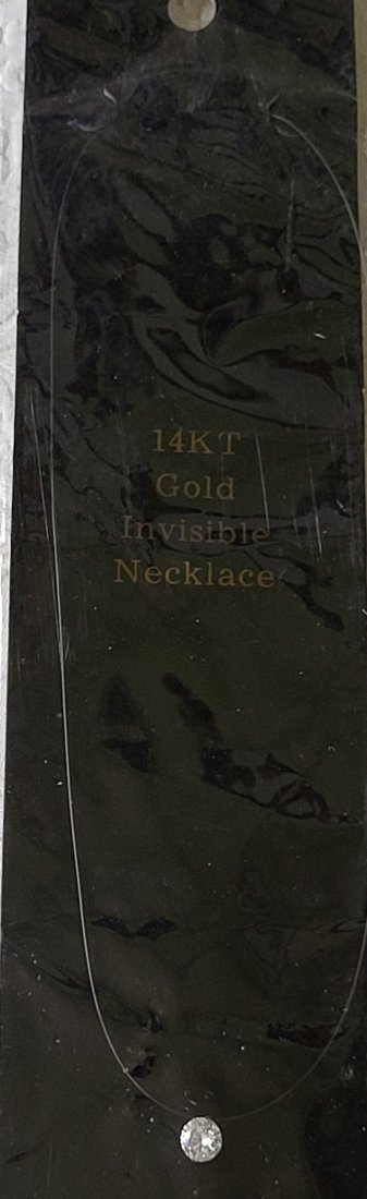 14K invisible necklace with cubic Zirconia vintage: beautiful 14K setting and appx 1 1/4 carat cubic zirconia and 14K clasp attached by monofilament line makes it appear to float very pretty from estate see pics