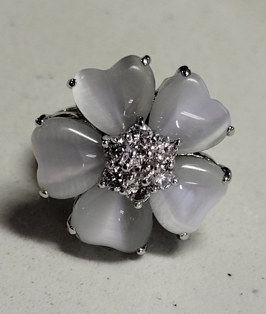 sterling & moonstone & white sapphires ring: gorgeous substantial sterling ring size 7 1/2 with heart shaped moonstones and center white sapphires all prong set unsure if man made or natural? see pics