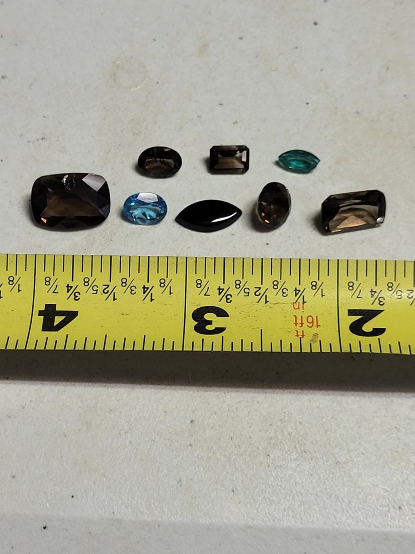 gemstones lot of 8! smokey topaz,emerald, several cuts: gemstones lot of 8! smokey topaz,emerald, several cuts from estate jewelry maker, all 8 for one bid unsure if natural or man made ? see pics all 8 for one bid