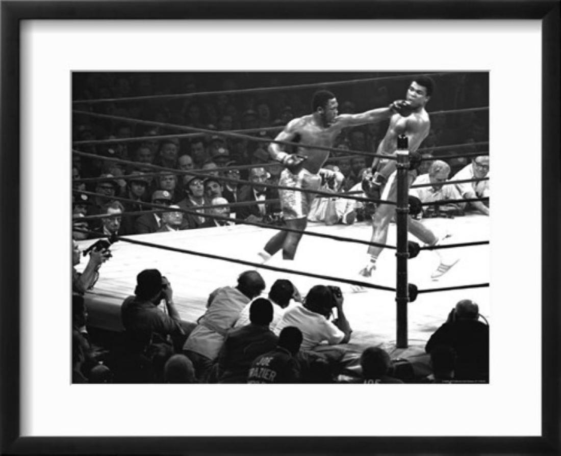 John Shearer "Joe Frazier Vs. Mohammed Ali at Madison: Joe Frazier Vs. Mohammed Ali at Madison Square Garden by John Shearer. Medium: Photographic Print. Custom Framed. Size: 21 x 17 inch.