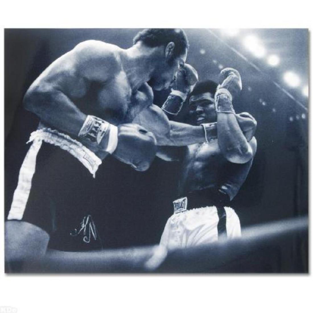 Licensed Photograph of the Heavyweight Champs Muhammad: Own a piece of sports history with this Muhammad Ali and Ken Norton photo. Taken at the peak of his success as one of the greatest heavyweight championship boxers of all time, this photo is sure to co