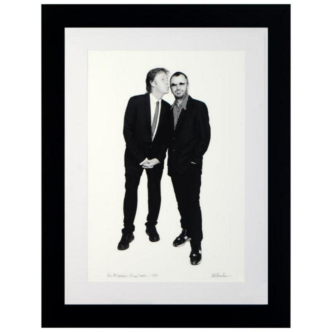 "Paul McCartney & Ringo Starr" Limited Edition Giclee: "Paul McCartney & Ringo Starr" is a limited edition giclee on paper, numbered and hand signed by acclaimed music industry photographer Rob Shanahan. This piece comes custom framed. Includes Certificat
