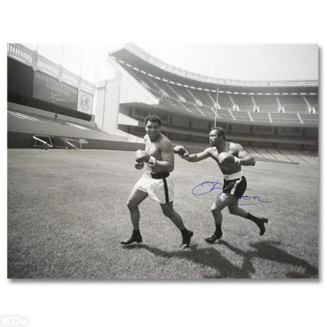 Must-Have Signed Sports Photo. "Ken Norton and Ali,: Perfect for any boxing enthusiast, "Ken Norton and Ali, Yankee Stadium" commemorates the world-famous boxing matches between Ken Norton and Muhammad Ali. This photograph is hand-autographed by multi-t
