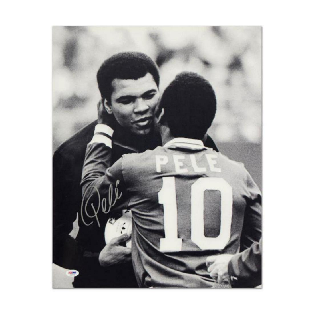 "Pele & Ali Hug" Print, Autographed by Legendary: "Pele & Ali Hug" is a print on paper that is autographed by legendary Brazilian footballer, Pele. This piece is presented with a Certificate of Authenticity from PSA/DNA, which authenticates sports me