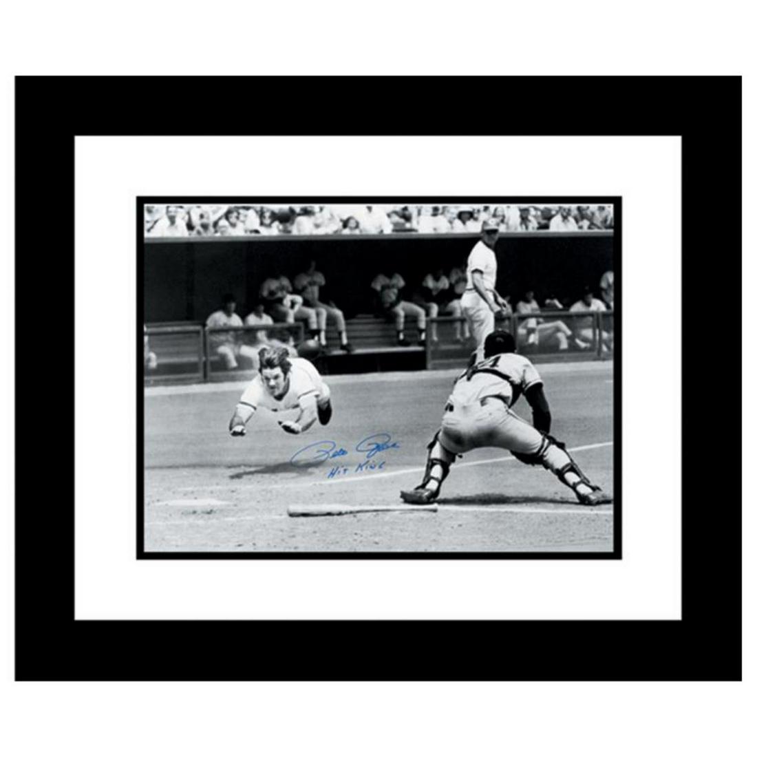 "Pete Rose Diving" Archival Photograph Taken on July: "Pete Rose Diving Into The Plate" is an archival photograph featuring the legendary baseball player diving safely into home plate! This photo was taken on July 30, 1972 and is autographed boldly by Pe