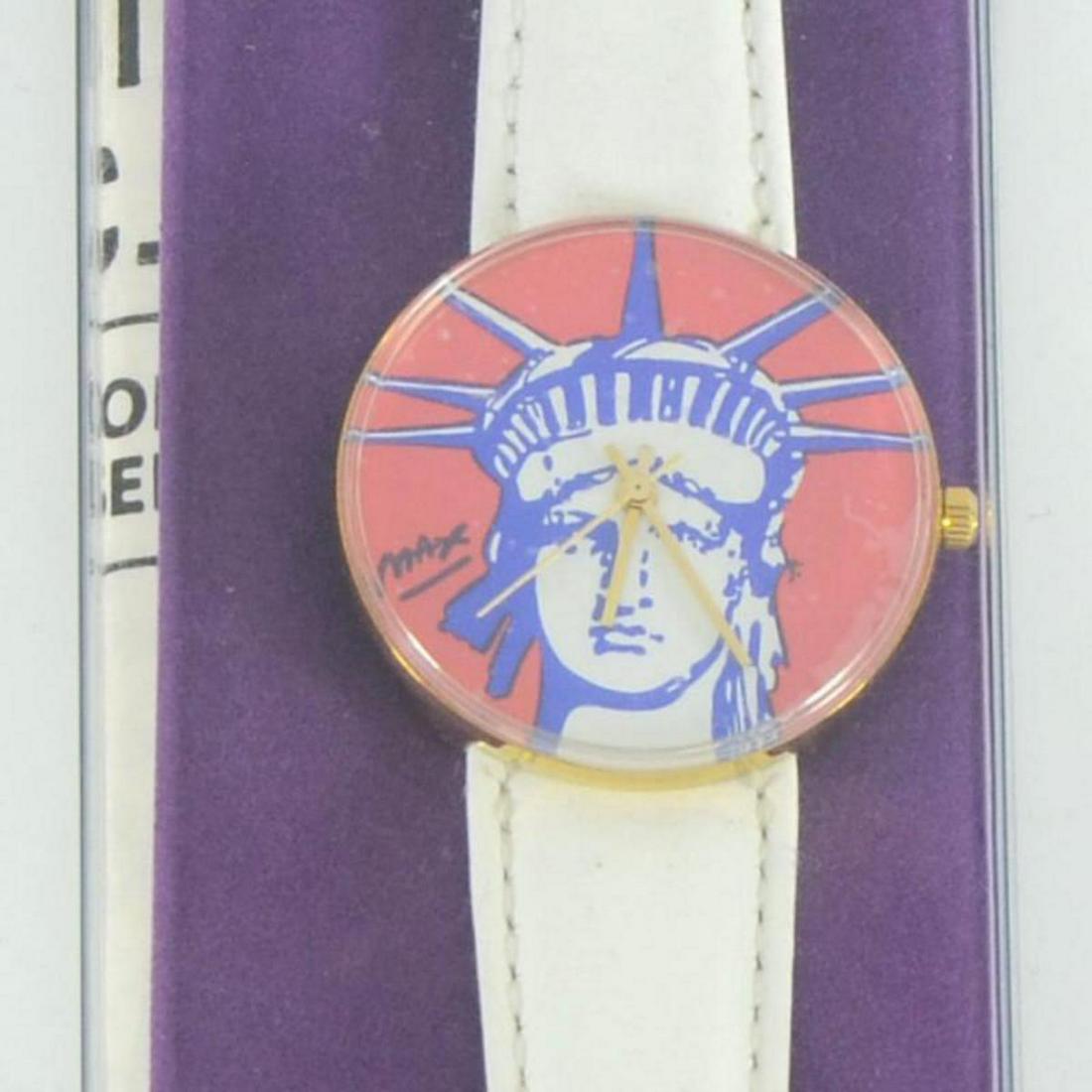 Vintage Peter Max "Liberty Head" Watch with Original: This is a vintage Peter Max "Liberty Head" wrist watch created for the Japanese market in 1991. This watch comes in the original packaging and with paperwork. Due to the age of the watch the battery w