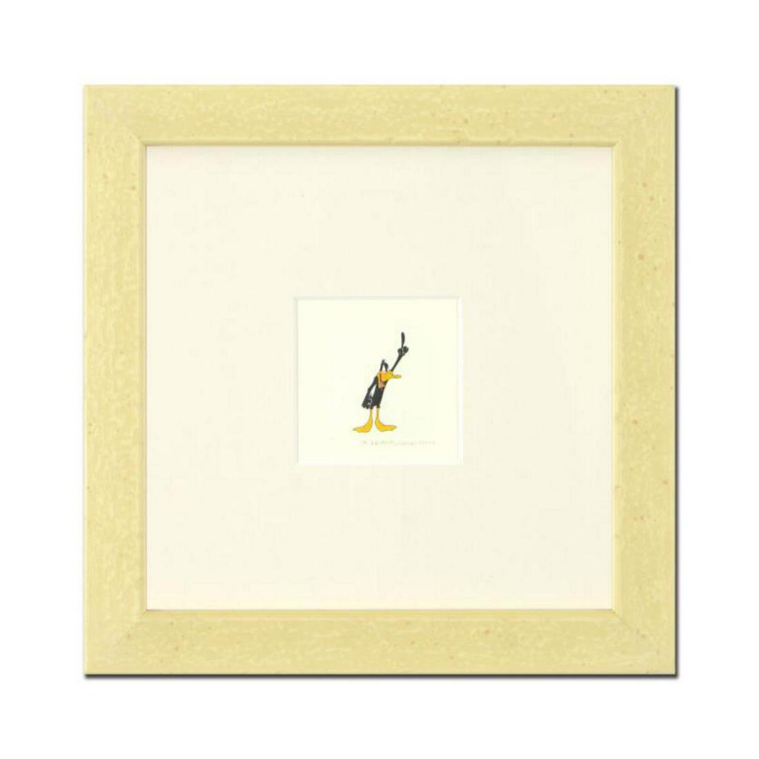 "Daffy Duck" Framed Limited Edition Etching with: "Daffy Duck (Looking to the Side)" is a limited edition etching on paper with hand-tinted coloring from Warner Bros, numbered and dated 1999. This piece comes framed. Measures approx. 9" x 9" (with fr