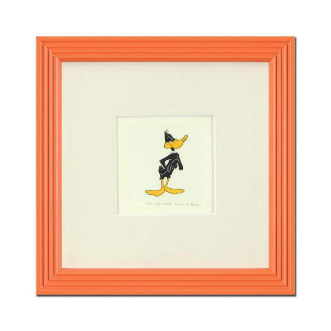 "Daffy Duck" Framed Limited Edition Etching with: "Daffy Duck (Looking to the Side)" is a limited edition etching on paper with hand-tinted coloring from Warner Bros, numbered and dated 1999. This piece comes framed. Measures approx. 9" x 9" (with fr
