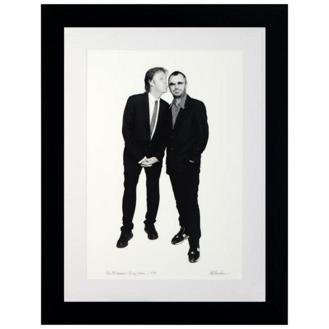 "Paul McCartney & Ringo Starr" Limited Edition Giclee: "Paul McCartney & Ringo Starr" is a limited edition giclee on paper, numbered and hand signed by acclaimed music industry photographer Rob Shanahan. This piece comes custom framed. Includes Certificat