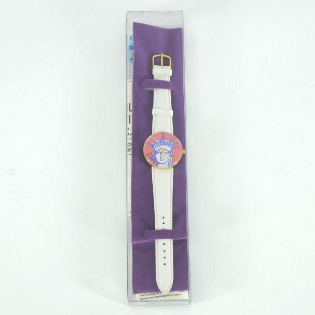 Vintage Peter Max "Liberty Head" Watch with Original: This is a vintage Peter Max "Liberty Head" wrist watch created for the Japanese market in 1991. This watch comes in the original packaging and with paperwork. Due to the age of the watch the battery w