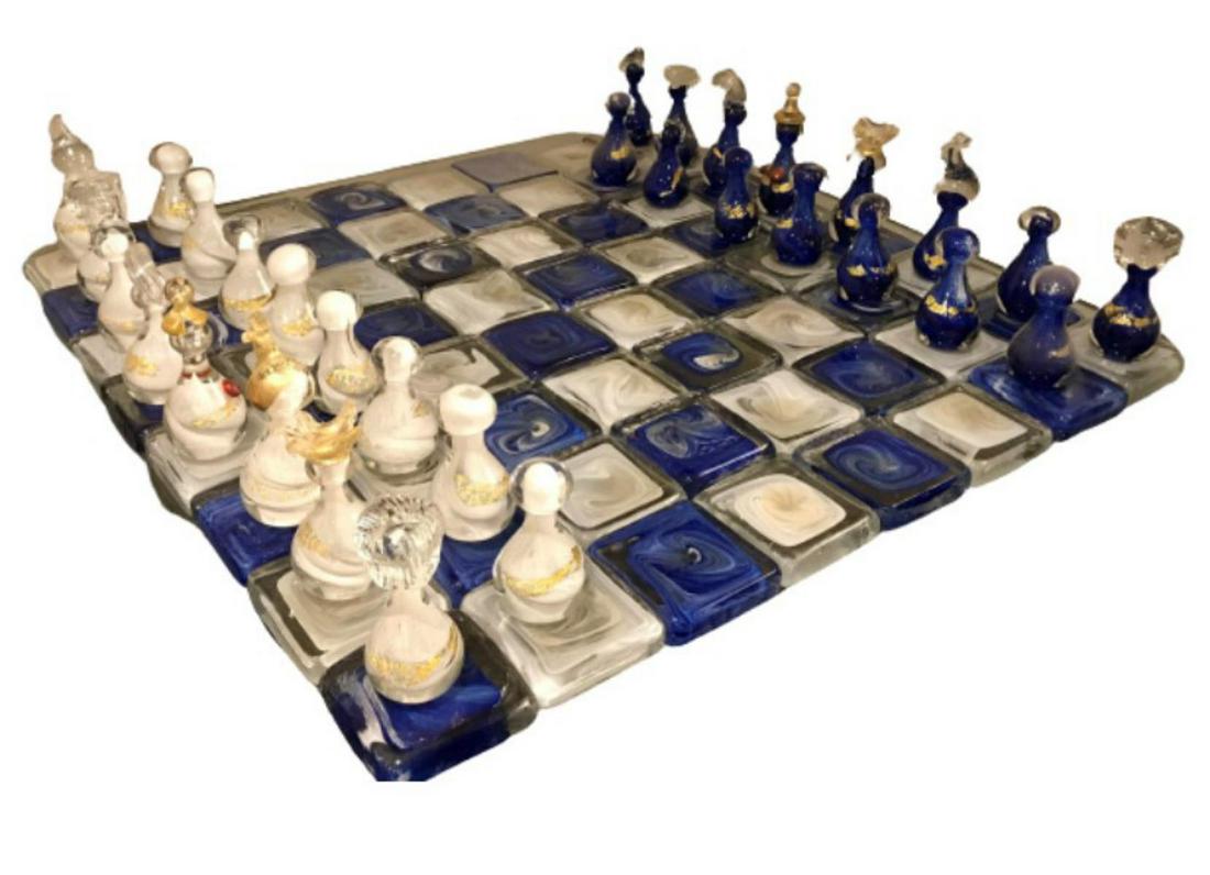 Jean Claude Novaro (1943-2014), France Original hand: Artist: Jean Claude Novaro (1943-2014), France. Medium: Original hand blown functional glass chess set. Title: Chess Set. Size: 40x40x36". Additional: Each Chess piece measures 2x6 inches and sits on 