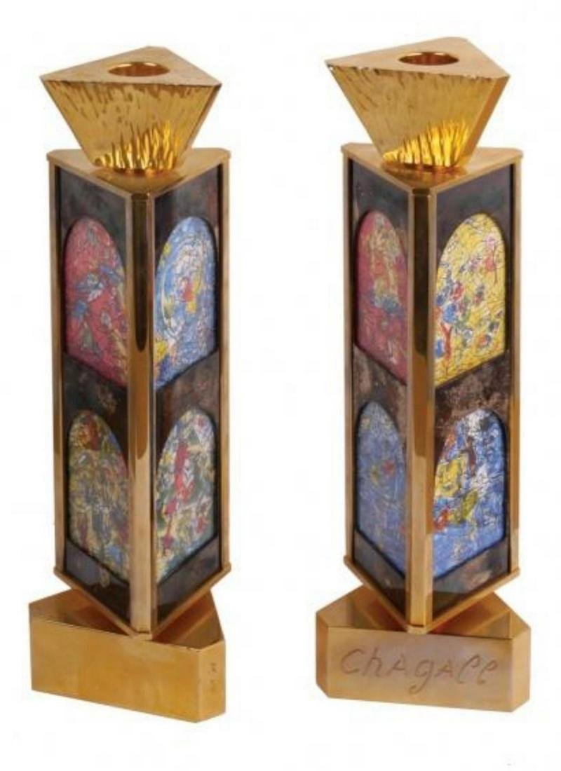 Marc Chagall Gold Triangular Rotating Candlesticks With: Artist: Marc Chagall. Medium: Gold Triangular Rotating Candlesticks With Images From the Jerusalem Windows. Title: . Signature: Limited Edition /300. Size: Each Candlestick is approximately: 10" high,