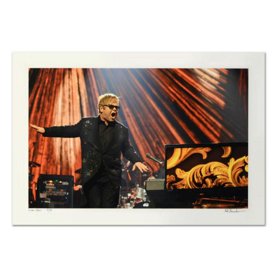 Rob Shanahan, "Elton John" Hand Signed Limited Edition: "Elton John" is a framed limited edition giclee on paper, numbered and hand signed by acclaimed music industry photographer Rob Shanahan. Includes Certificate of Authenticity. Measures approximately 2
