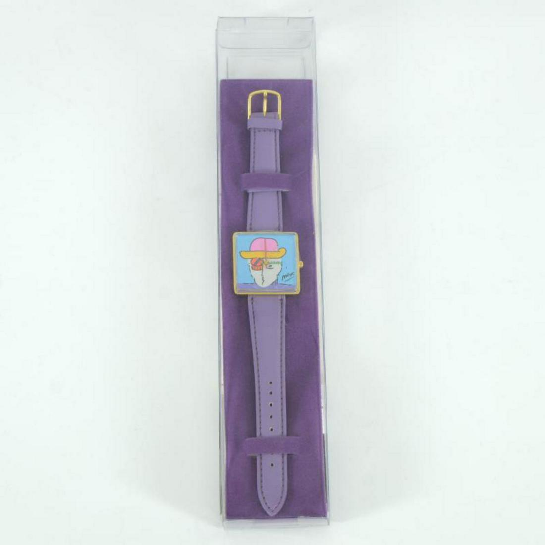 Vintage Peter Max "Face" Watch with Original Packaging: This is a vintage Peter Max "Face" wrist watch created for the Japanese market in 1991. This watch comes in the original packaging and with paperwork. Due to the age of the watch the battery will need