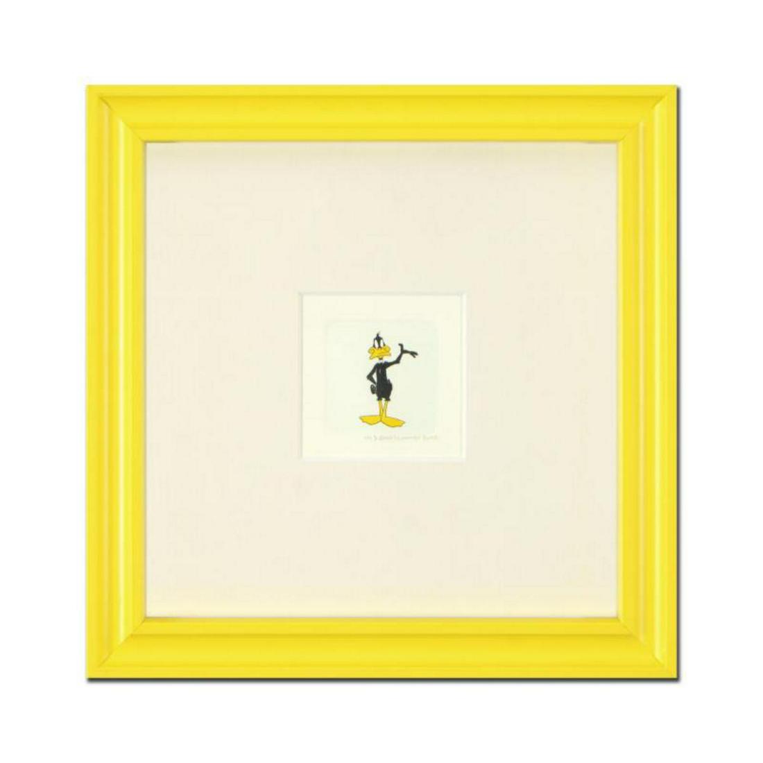 "Daffy Duck" Framed Limited Edition Etching with: "Daffy Duck (Looking to the Side)" is a limited edition etching on paper with hand-tinted coloring from Warner Bros, numbered and dated 1999. This piece comes framed. Measures approx. 9" x 9" (with fr