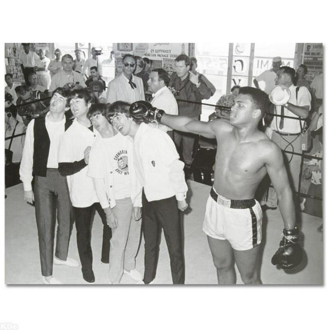"Muhammad Ali Punching The Beatles" Licensed Photograph of Heavyweight Champ Muhammad Ali and the: Own a piece of sports history with this Muhammad Ali and Beatles photo. Taken at the peak of his success as one of the greatest heavyweight championship boxers of all time, this photo is sure to compl