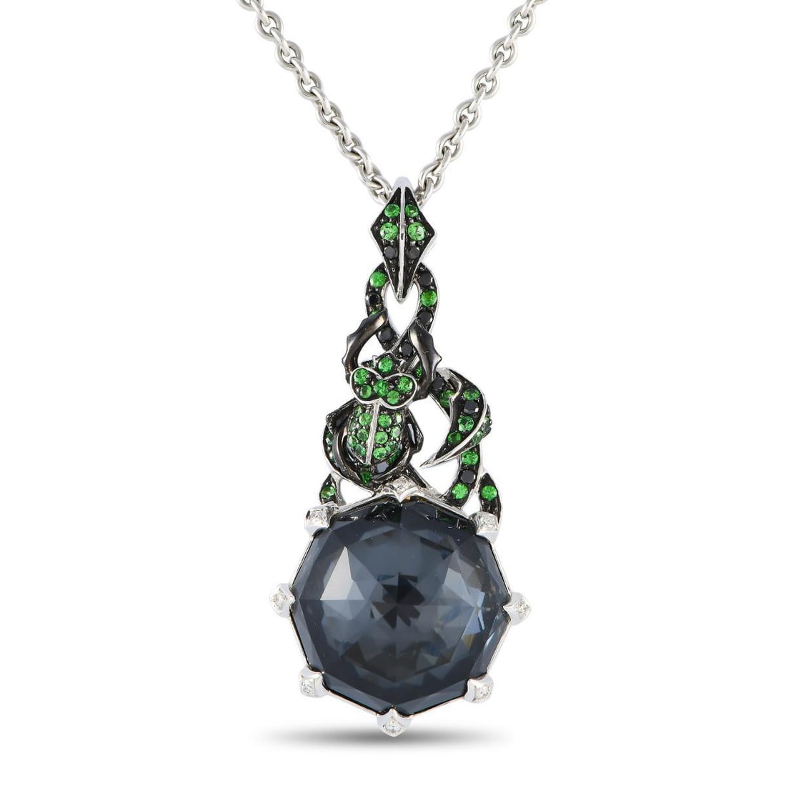 Stephen Webster 18K White Gold Quartz and Tsavorite Pendant Necklace: This Stephen Webster necklace has an instantly captivating appearance that will continually draw the eye and capture your imagination. Suspended from a 17 chain, youll find a dynamic serpentine pendan