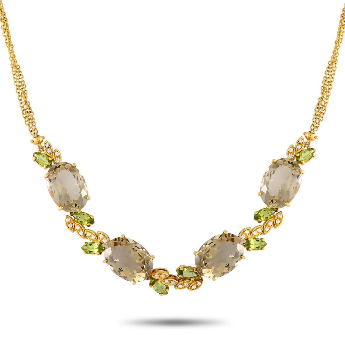 Bucherer 18K Yellow Gold 0.50ct Diamond, Quartz and Peridot Necklace: Ready for the next soire? Polish your outfit with this impressive multi-gem necklace from Bucherer. This 17-inch-long necklace in 18K yellow gold boasts a double chain detailed with an opulent trail o