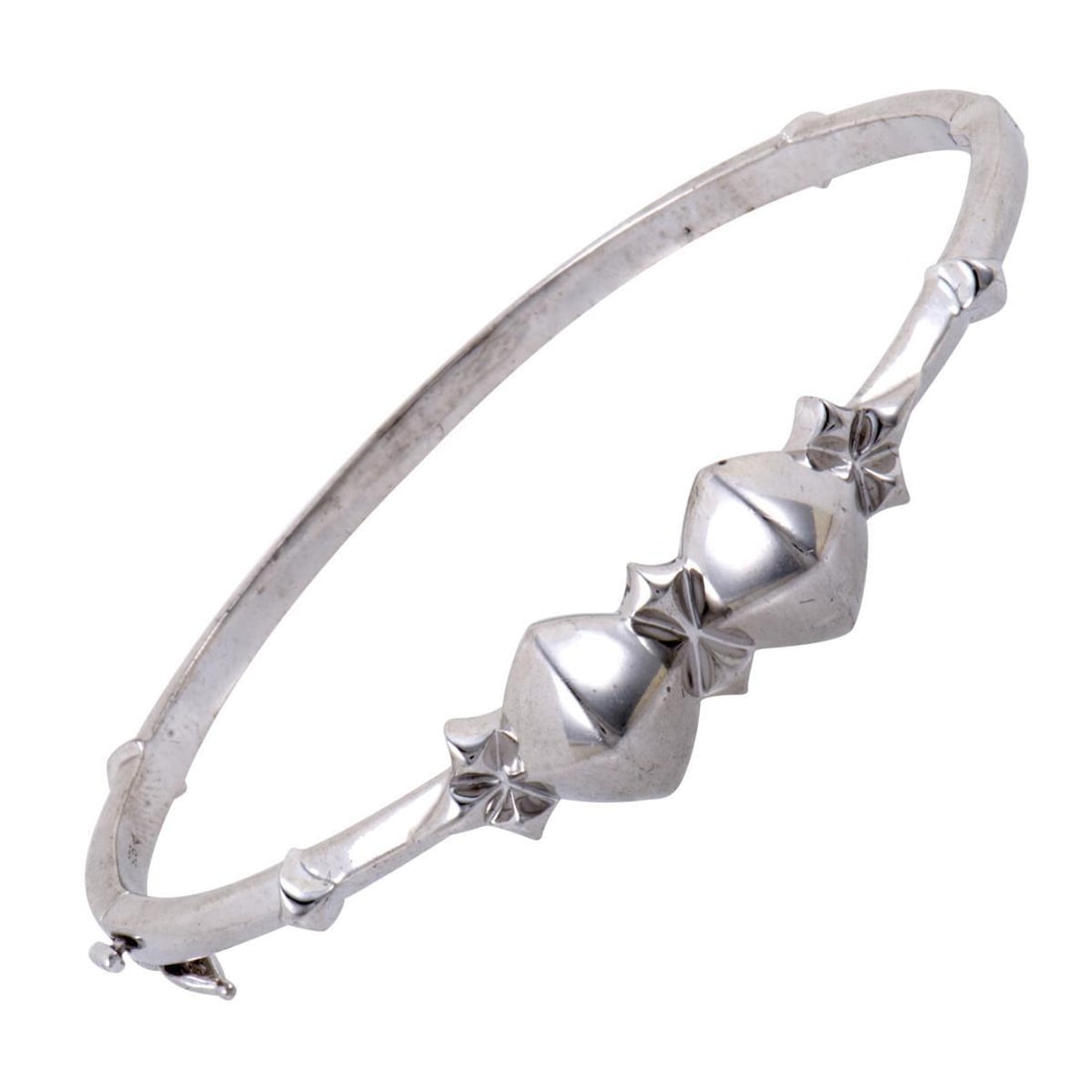 STEPHEN WEBSTER NEW SUPERSTUD SILVER BANGLE BRACELET: Made entirely of exceptionally bright and immaculately gleaming white rhodium-plated silver, this fascinating bangle from Stephen Webster is designed in the brands recognizable style and crafted with