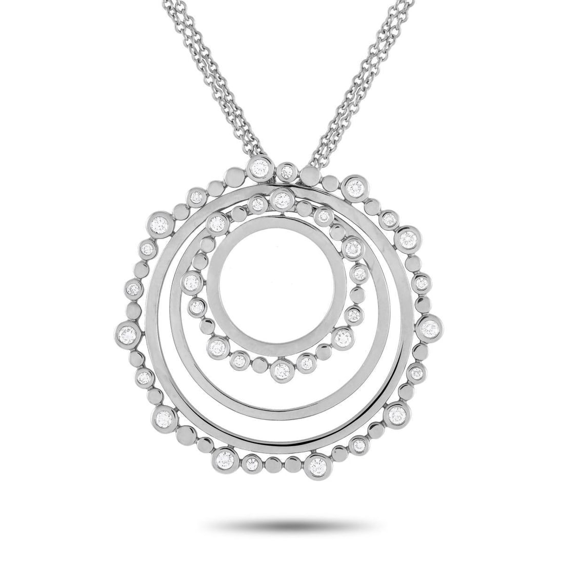 BUCHERER 18K WHITE GOLD 0.69CT DIAMOND CIRCLE NECKLACE: A versatile jewel you can wear time and time again. This white gold necklace by Bucherer features a 30-inch-long double chain holding a round pendant with concentric circles. The 1.5-inch-wide pendant