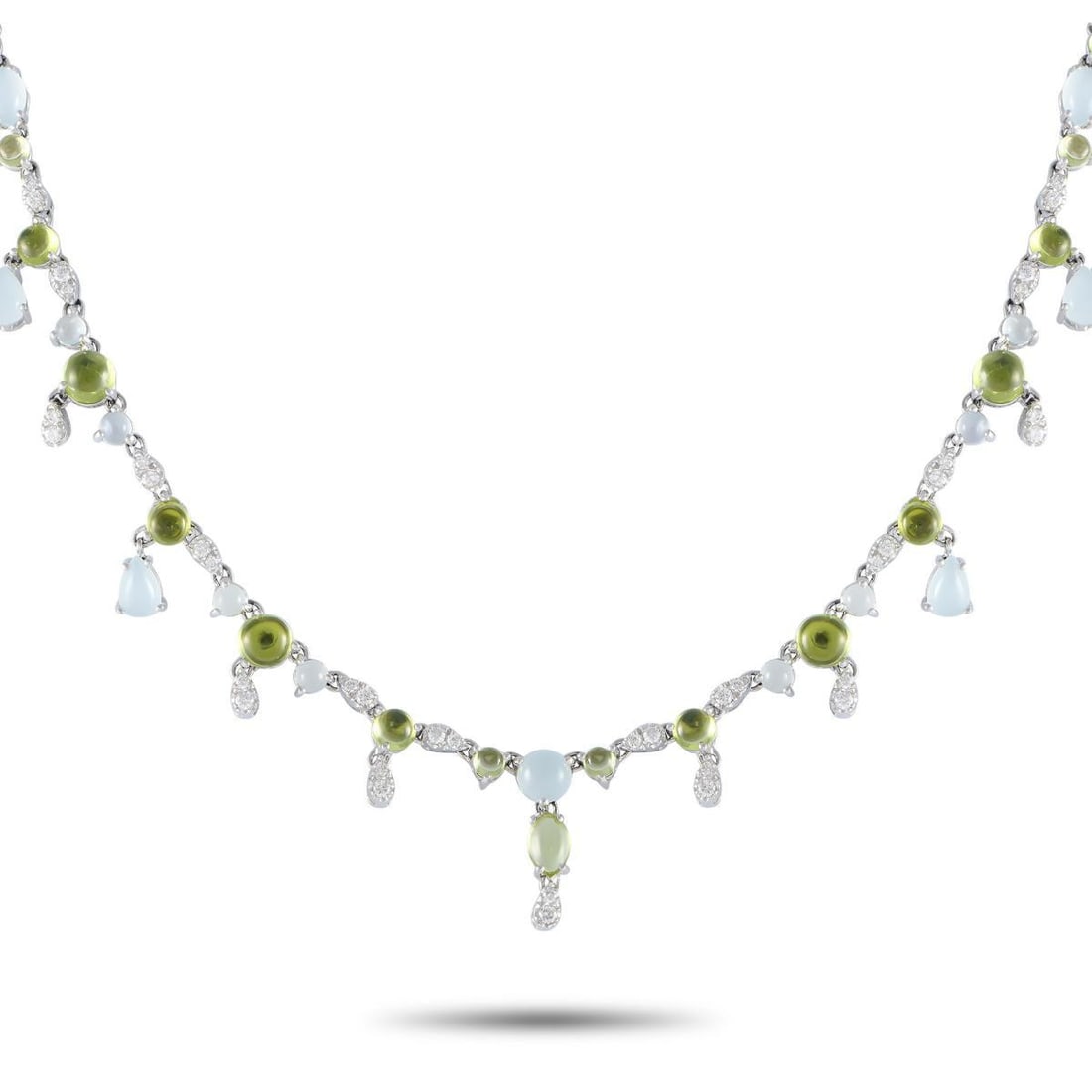 BUCHERER 18K WHITE GOLD 0.55CT DIAMOND, AQUAMARINE AND PERIDOT NECKLACE: This Bucherer creation can do many things. It can accentuate your collarbone, draw attention to your face, and elevate a monochromatic outfit effortlessly. The necklace is crafted in 18K white gold an