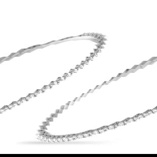 14K WHITE GOLD 1.55CT LAB-GROWN DIAMOND BRACELET: This elegant bangle tennis bracelet exudes quiet luxury. The minimalist 14K White Gold setting beautifully showcases this pieces stunning series of Lab Grown Diamonds, which together possess a total w